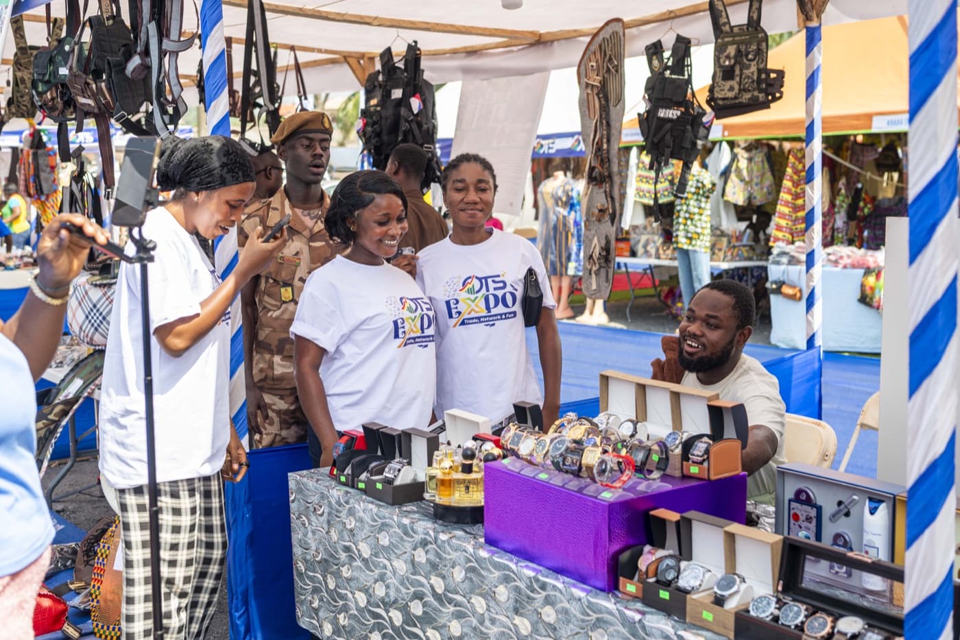 The OTS team visits an exhibitor's accessories stall