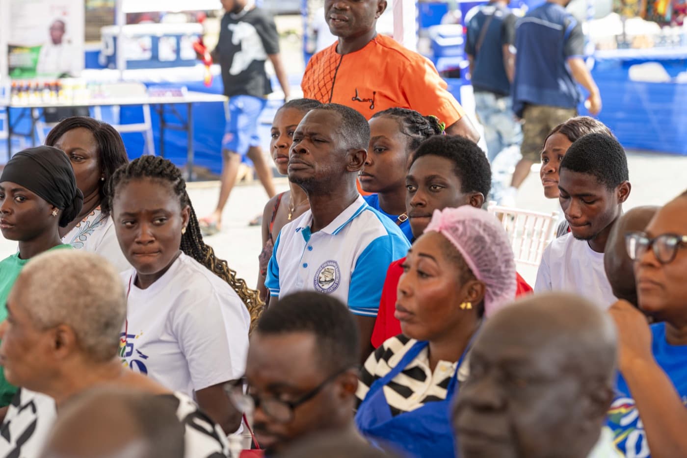 The audience follows the opening ceremony